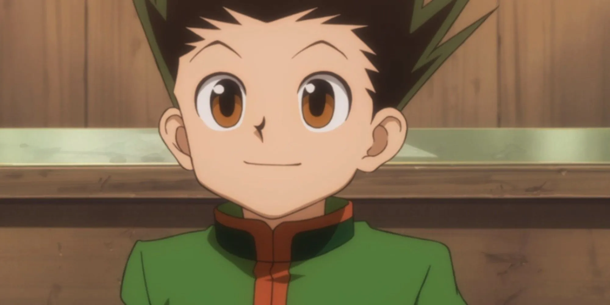 Gon Freecss trong Hunter x Hunter mỉm cười nhẹ, thể hiện sự quyết tâm