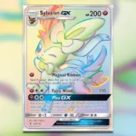 Thẻ bài Sylveon GX Secret Rare từ set Guardians Rising trong Pokemon TCG, thể hiện giá trị cao và thiết kế màu sắc cầu vồng đặc trưng.